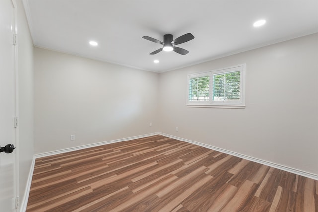 unfurnished room featuring ceiling fan, dark hardwood / wood-style flooring, and ornamental molding