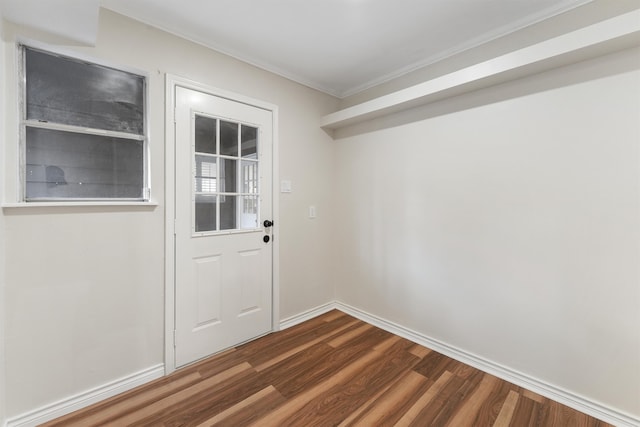 entryway featuring dark hardwood / wood-style floors and ornamental molding