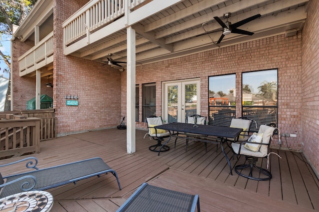 wooden terrace featuring ceiling fan and french doors