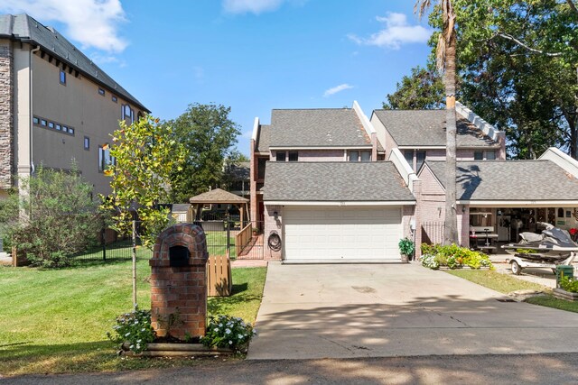 view of front property with a garage and a front lawn