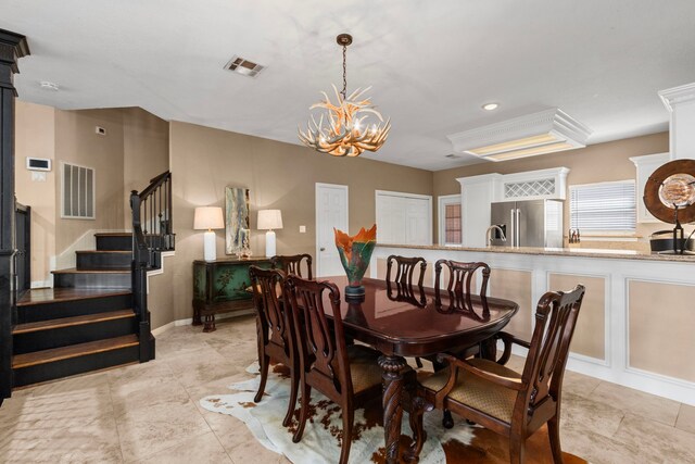 dining area with an inviting chandelier