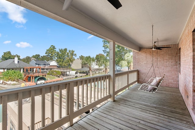 wooden deck with ceiling fan