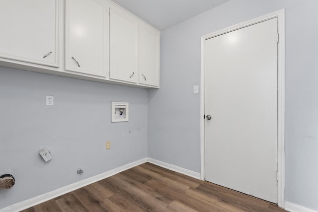 clothes washing area with washer hookup, cabinets, and hardwood / wood-style flooring