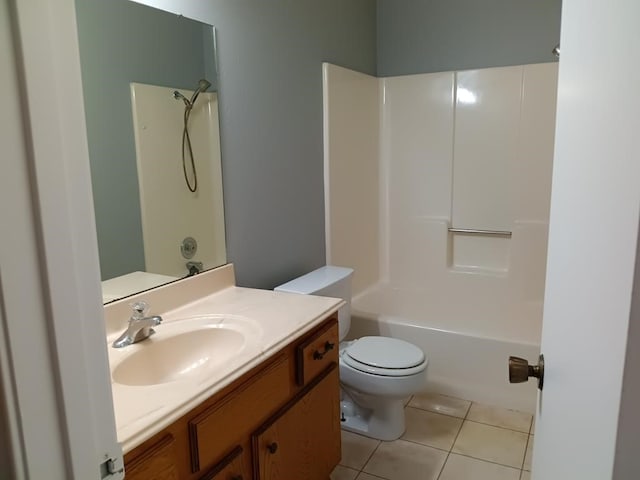 full bathroom with tile patterned floors, shower / washtub combination, vanity, and toilet