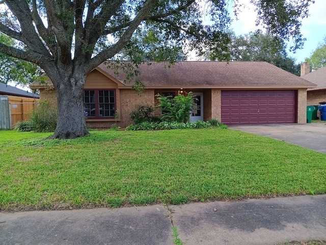 single story home featuring a front lawn and a garage