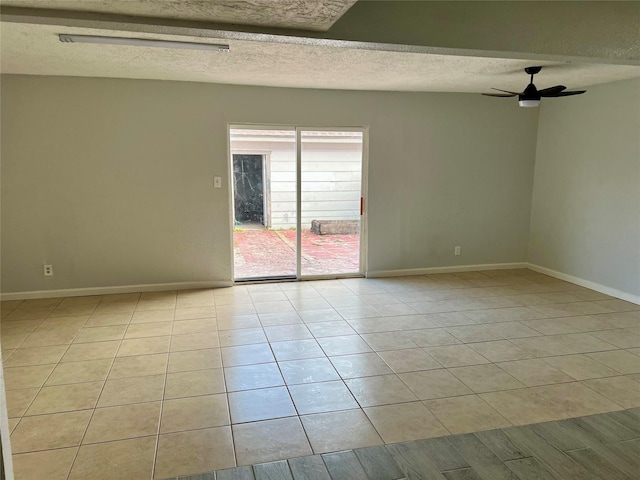 unfurnished room featuring ceiling fan, light hardwood / wood-style flooring, and a textured ceiling