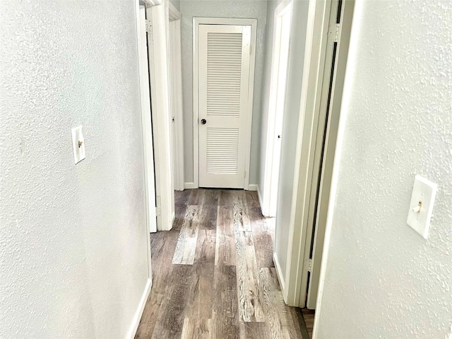 corridor with wood-type flooring