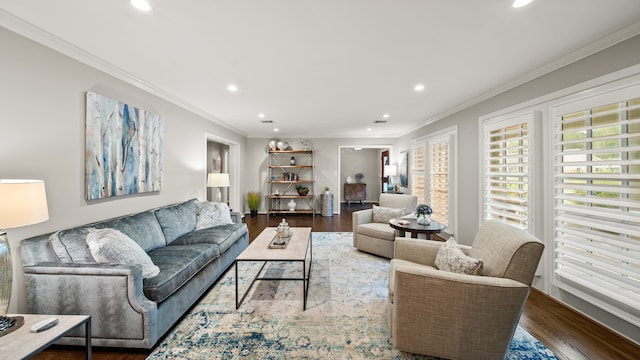 living room with hardwood / wood-style flooring and crown molding