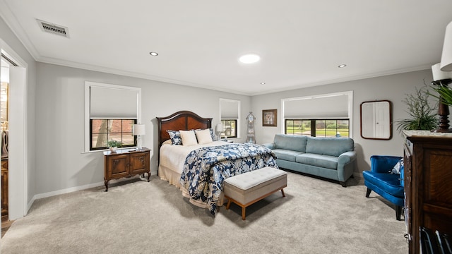 carpeted bedroom with ornamental molding