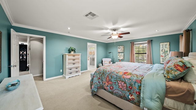 carpeted bedroom with ceiling fan, ensuite bath, and ornamental molding