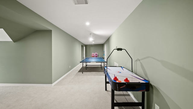 game room with light colored carpet