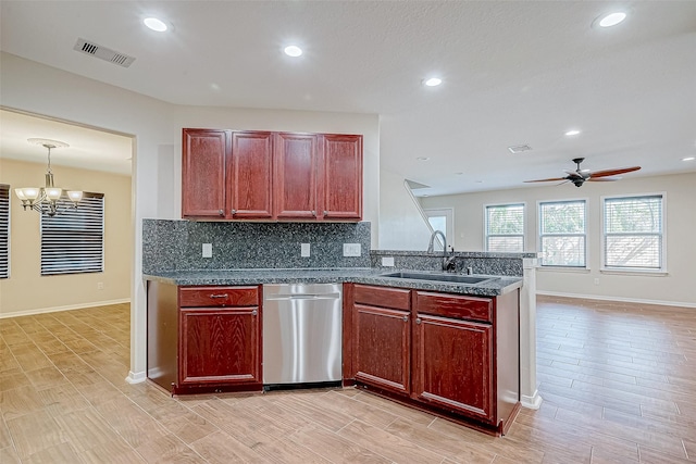 kitchen with ceiling fan with notable chandelier, sink, stainless steel dishwasher, light wood-type flooring, and decorative light fixtures