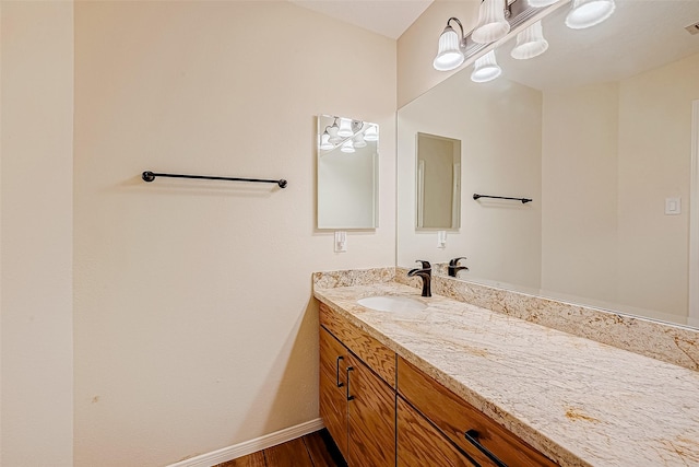 bathroom with vanity and wood-type flooring