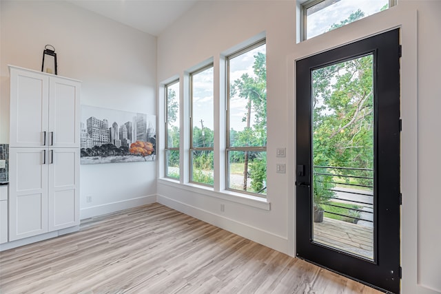 doorway to outside with light hardwood / wood-style flooring