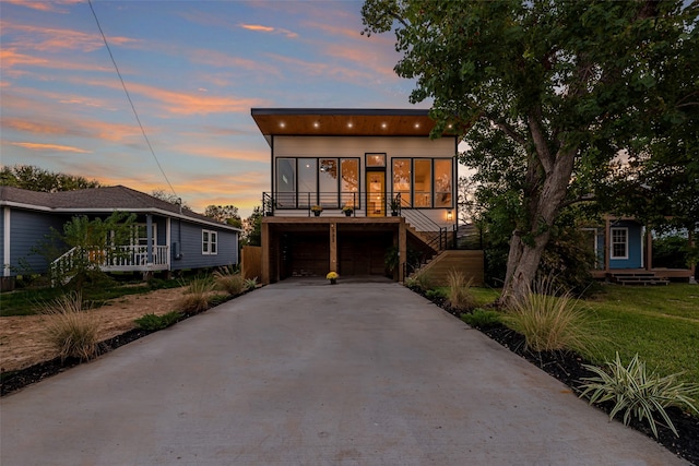 modern home featuring a garage and a porch