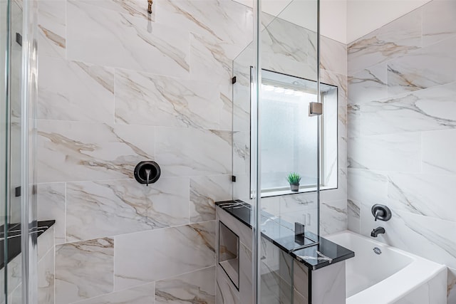 bathroom with plenty of natural light and independent shower and bath