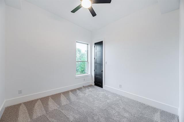 empty room featuring ceiling fan and carpet floors