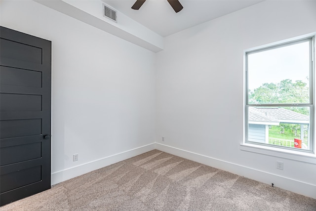 carpeted empty room with ceiling fan