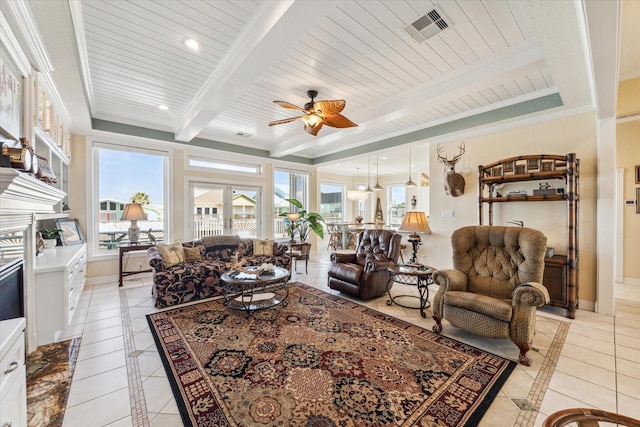 tiled living room featuring beamed ceiling, ceiling fan, crown molding, and wooden ceiling