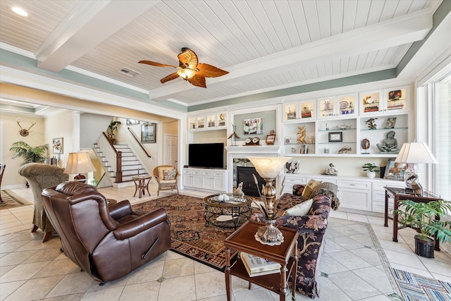 living room with light tile patterned floors, wood ceiling, and beam ceiling