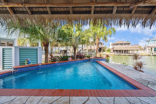 view of pool featuring a water view