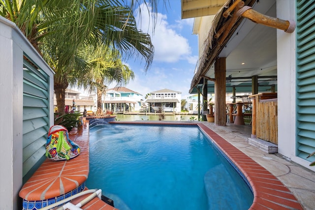 view of swimming pool featuring pool water feature