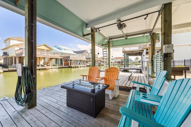 102 Bamaku Bnd, Tiki Island, TX 77554 - dock with a fire pit, a residential view, a water view, and boat lift