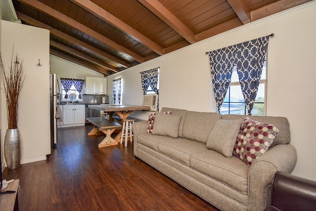 living room with lofted ceiling with beams, wood ceiling, dark hardwood / wood-style floors, and plenty of natural light