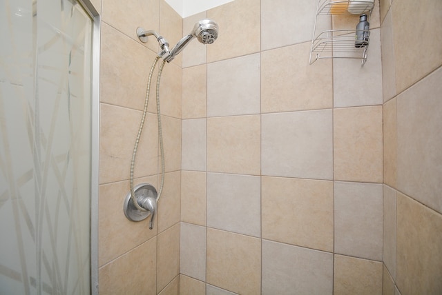 bathroom with a tile shower