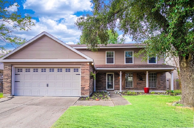 view of front of house with a front lawn, a garage, and covered porch