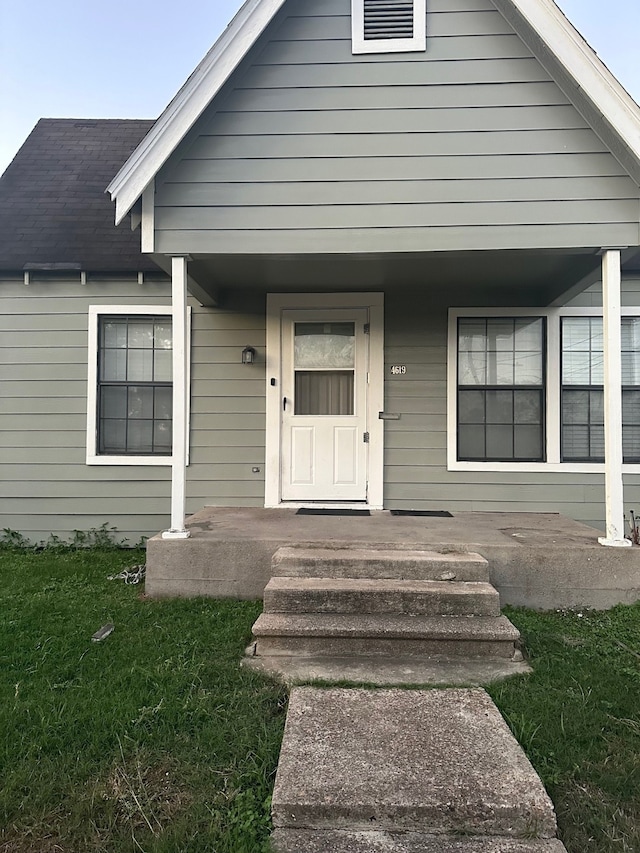 doorway to property featuring covered porch