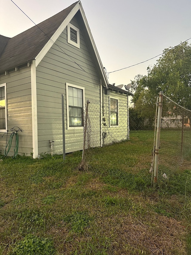 rear view of house with a yard