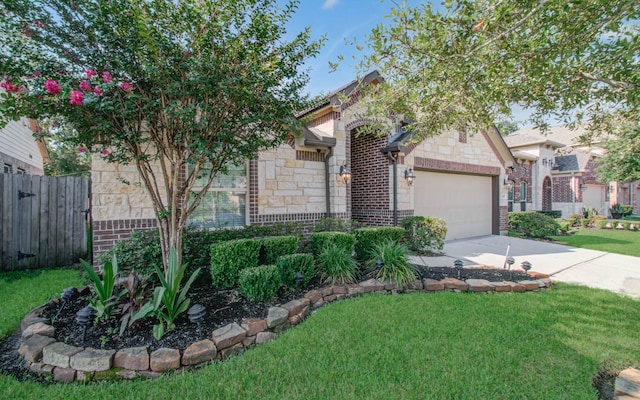 view of front facade with a garage and a front yard