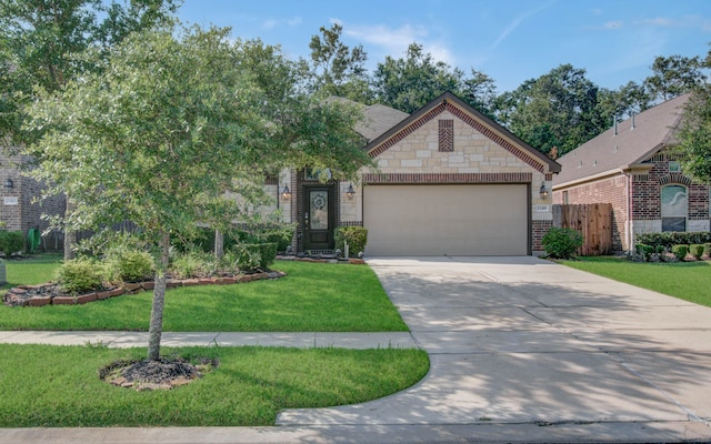 view of front of property featuring a garage and a front yard