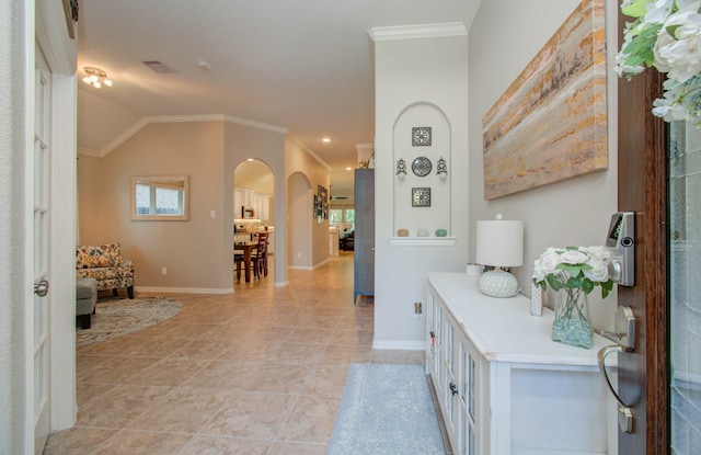 interior space with lofted ceiling, light tile patterned floors, and crown molding