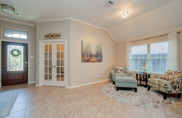 sitting room featuring french doors, lofted ceiling, light tile patterned floors, and crown molding