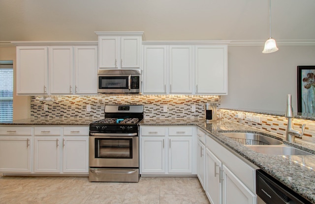 kitchen with ornamental molding, appliances with stainless steel finishes, decorative light fixtures, sink, and white cabinets