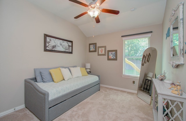 living room featuring plenty of natural light, light colored carpet, and vaulted ceiling