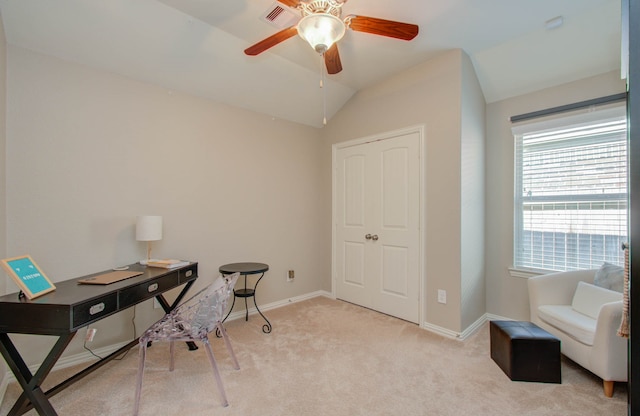 home office with ceiling fan, light colored carpet, and lofted ceiling