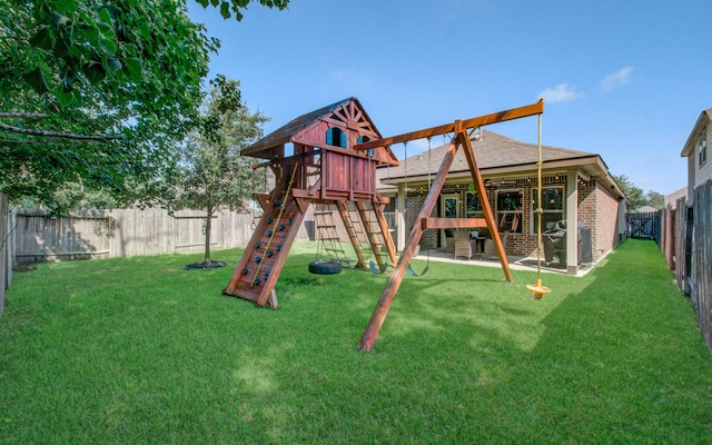 view of play area featuring a lawn