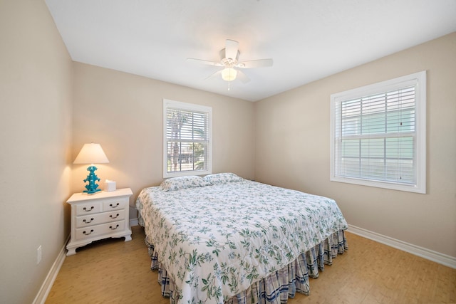 bedroom with wood-type flooring and ceiling fan