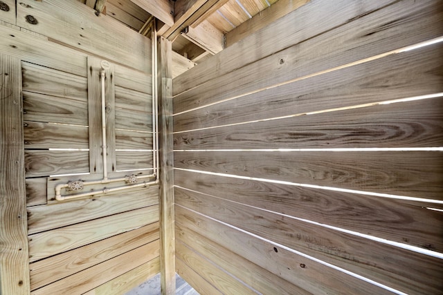 details with wood walls and wood ceiling