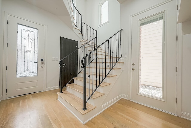 foyer with light hardwood / wood-style floors