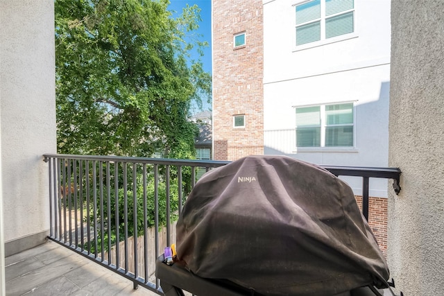 view of home's exterior with a balcony