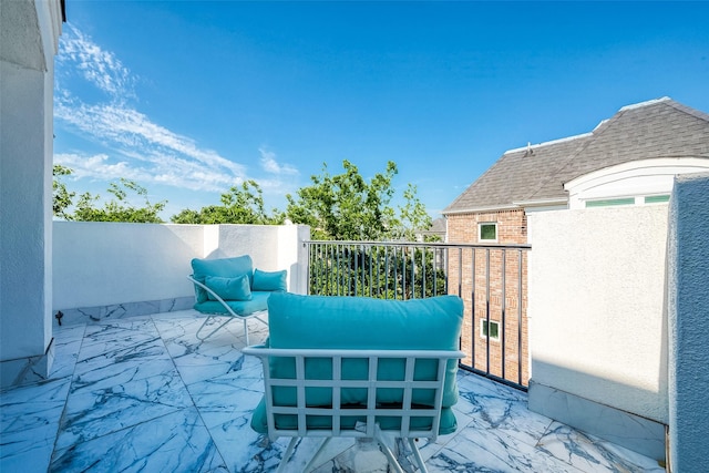 view of patio with a balcony