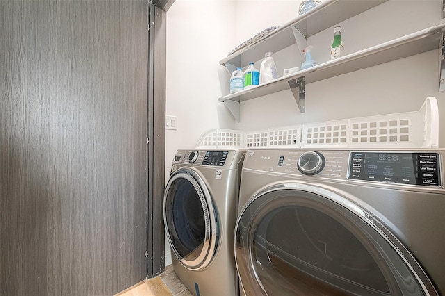 clothes washing area with independent washer and dryer