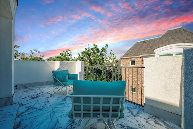 view of patio terrace at dusk