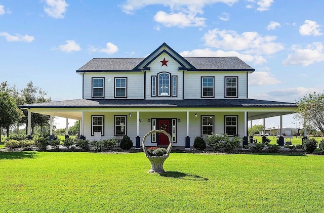 farmhouse inspired home featuring covered porch and a front yard