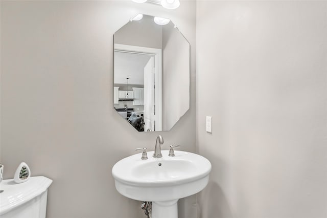 bathroom with sink and toilet