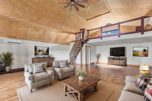 living room with an AC wall unit, wood ceiling, hardwood / wood-style flooring, and ceiling fan